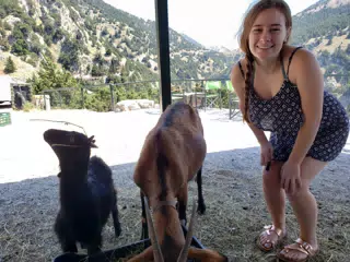 Madeline Posing with Goats