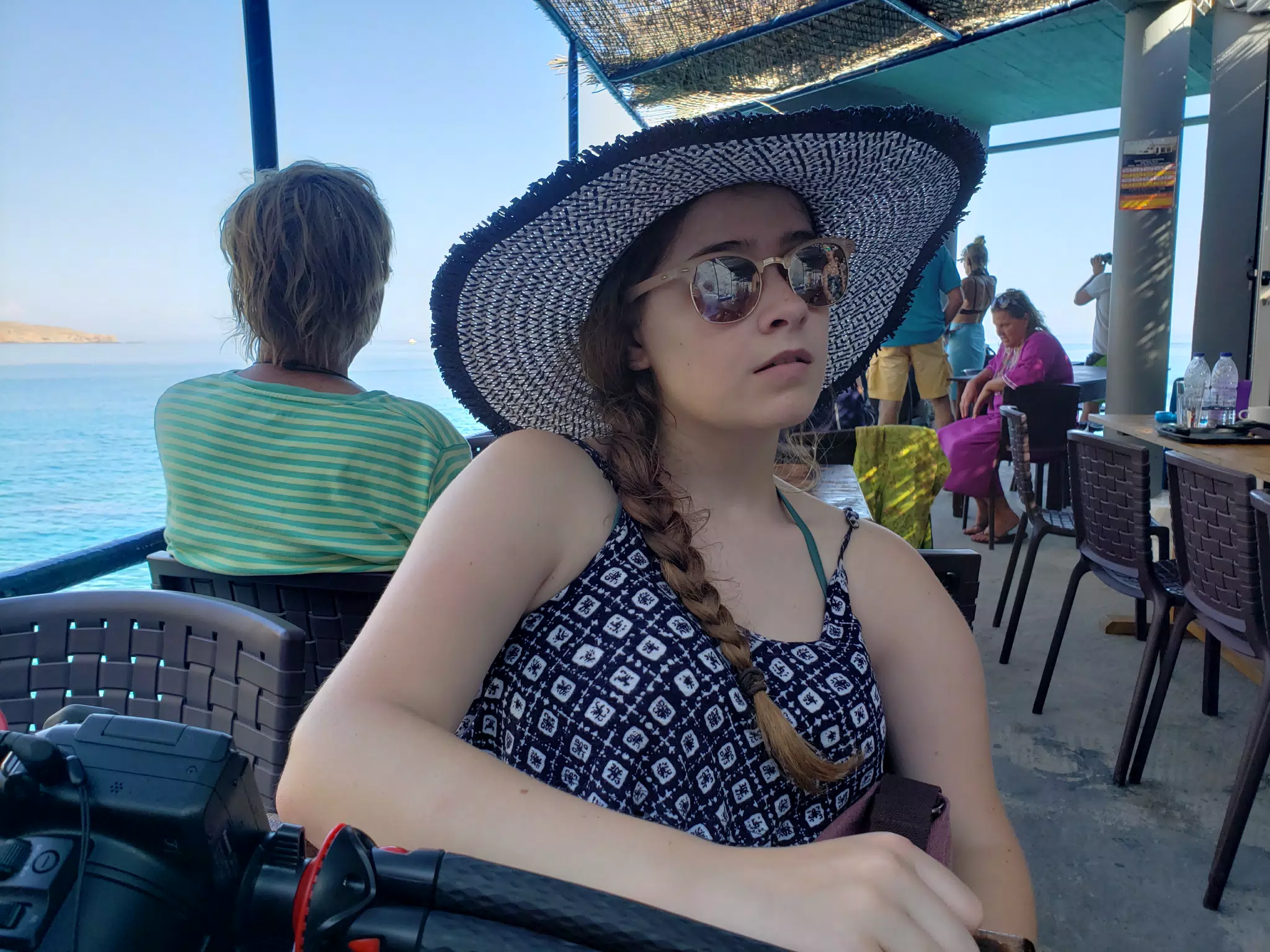Madeline Waiting at Restaurant on Crete