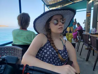 Madeline Waiting at Restaurant on Crete