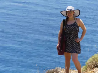 Madeline in Hat and Beach Coverup on Crete