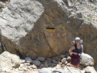 Madeline Standing by Glyka Nera Trail Marker