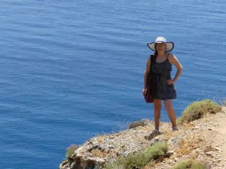 Madeline on Greek Beach Trail in Hat and Dress