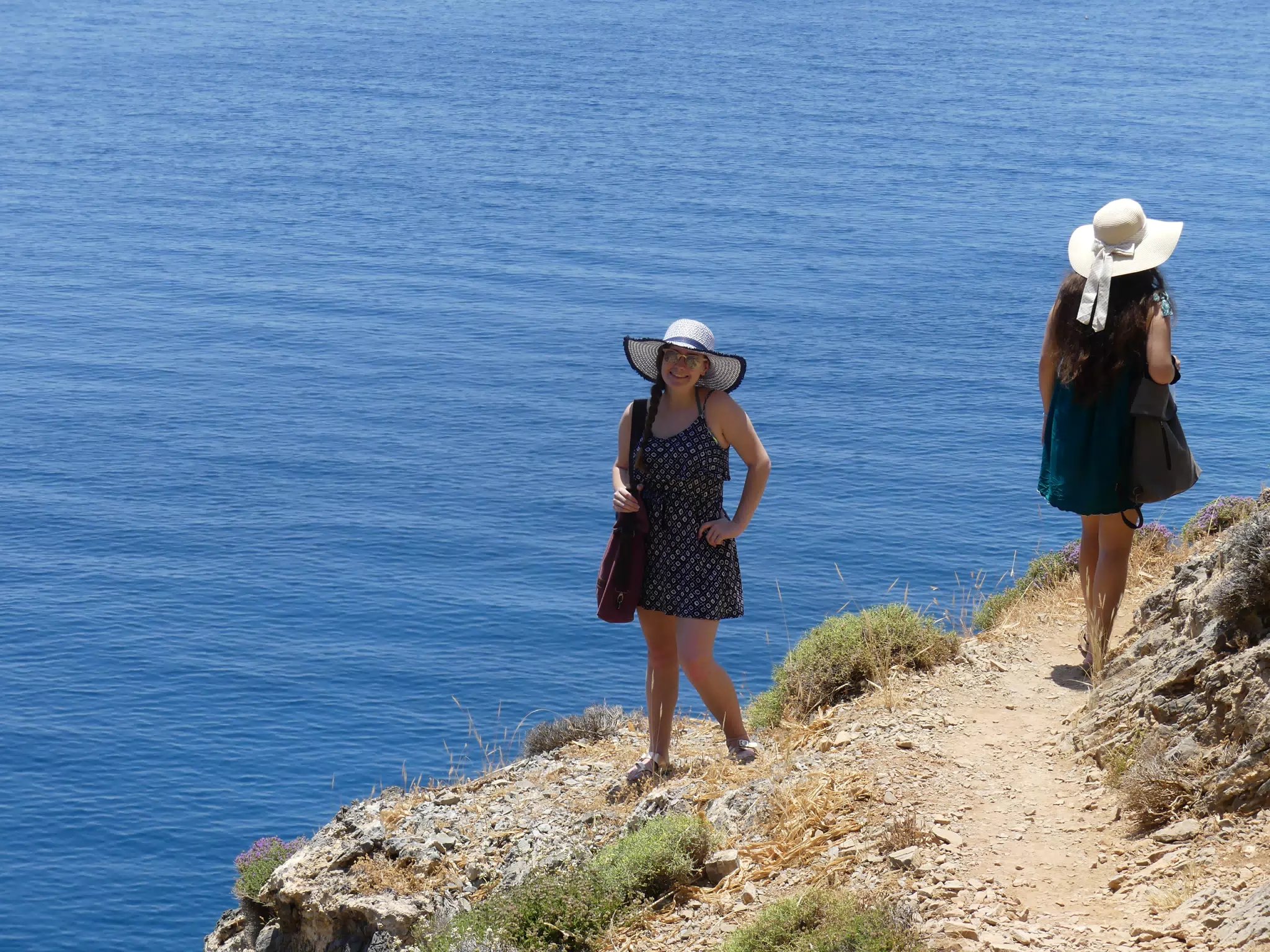 Madeline Posing in Hat on Trail by Sea