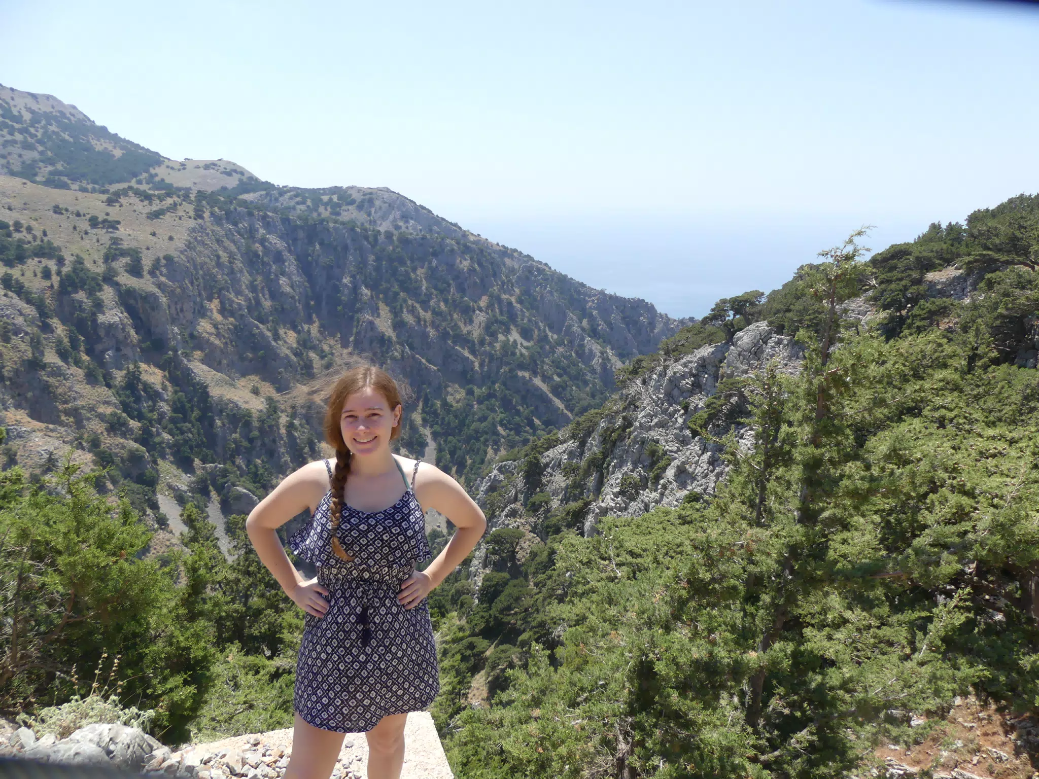 Teen Girl Standing Above Canyon on Crete