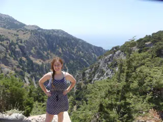 Teen Girl Standing Above Canyon on Crete