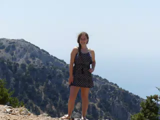 Madeline on Cliff Edge Above the Sea by Canyon on Crete