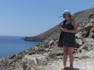 Madeline Checking Phone on Trail Hike on Crete