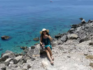Emily on Beach Trail on Crete in Hat and Dress