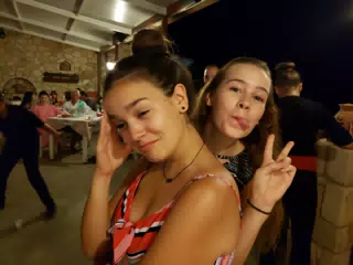 Emily and Madeline Get Pulled Into the Folk Dancing at the Cretan Corner