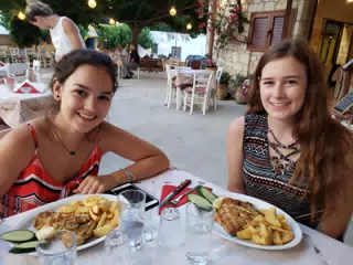Emily & Madeline with Dinner at the Cretan Corner in Aptera