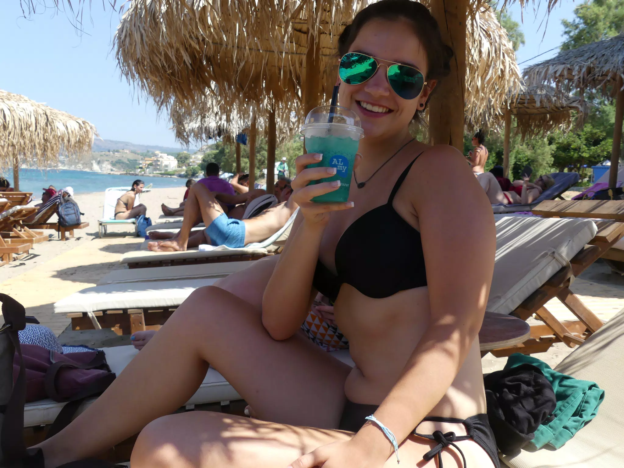 Emily with Cocktail on Kolatsos Beach