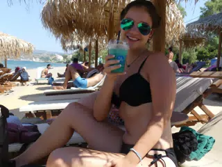 Emily with Cocktail on Kolatsos Beach
