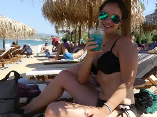 Emily with Cocktail on Kolatsos Beach