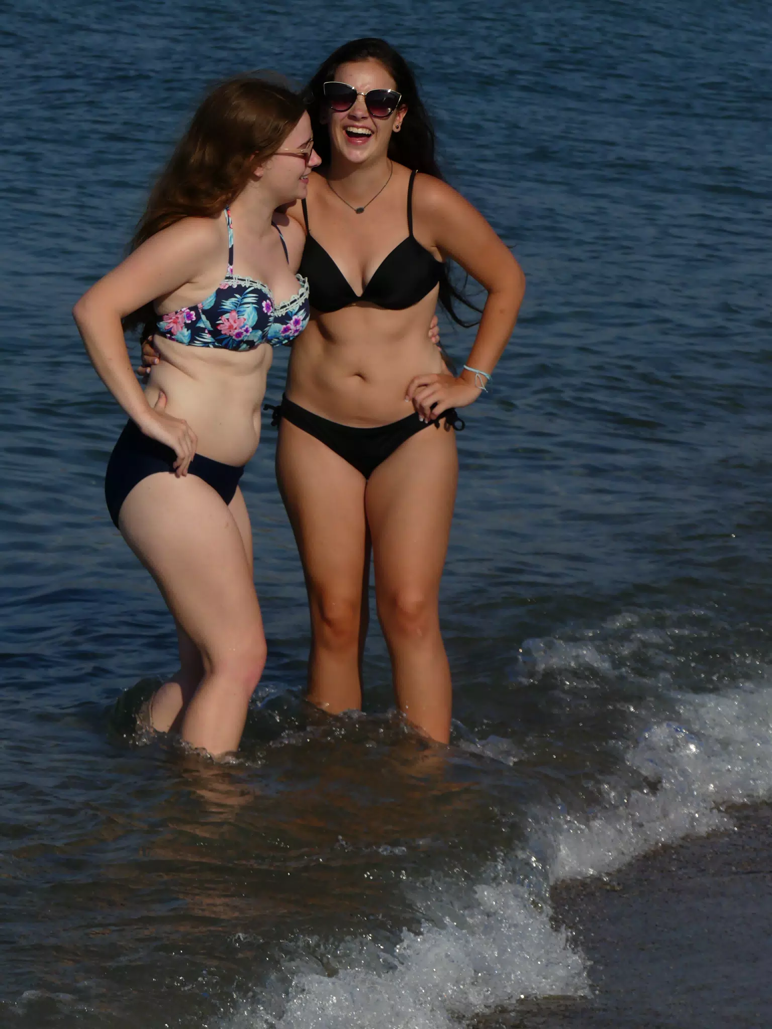 Girls in Swimsuits Laughting in Sea