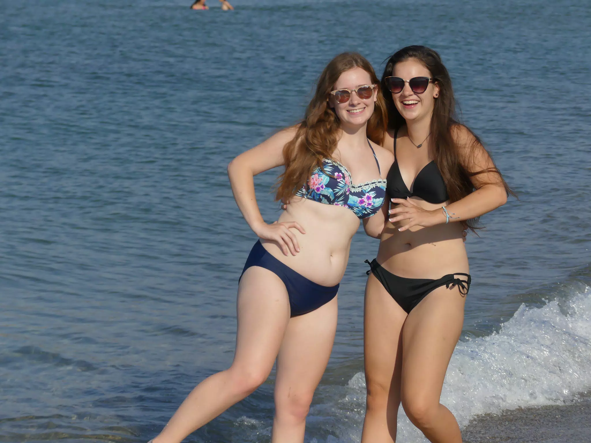 Sisters Having Fun on Greek Beach in the Water