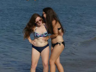 Girls Giggling on Beach