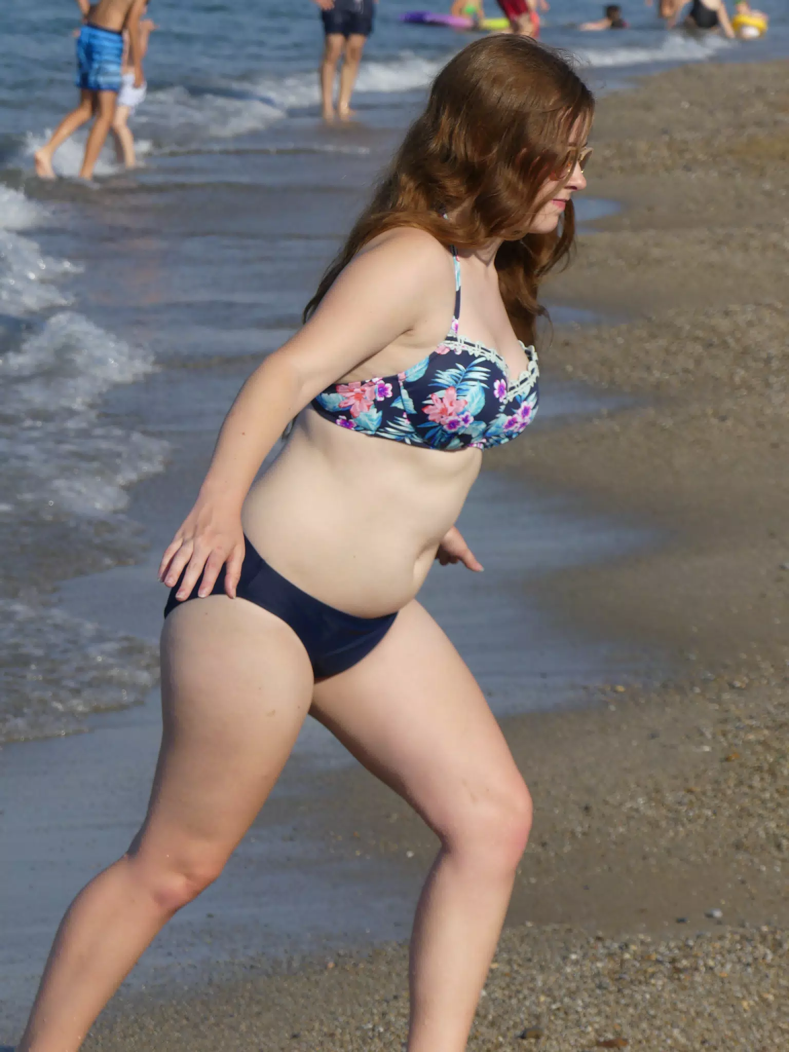 Girl Walking Up Beach
