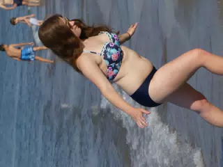 Girl Walking Up Beach