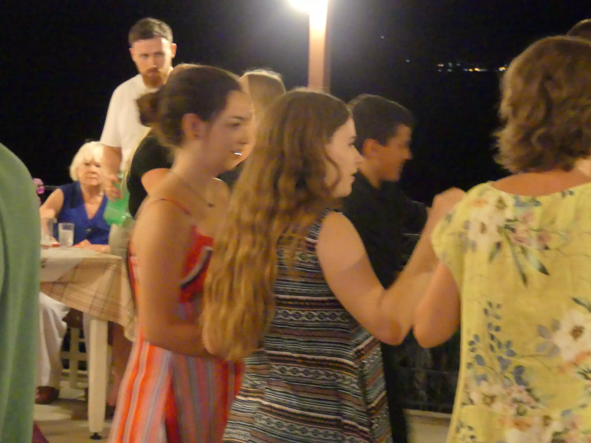 Emily and Madeline Folk Dancing at the Cretan Corner