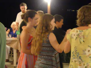 Emily and Madeline Folk Dancing at the Cretan Corner