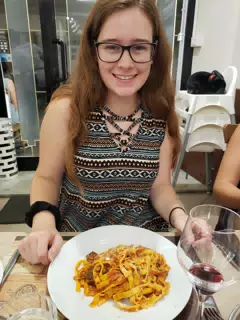 Madeline with First Pasta in Italy