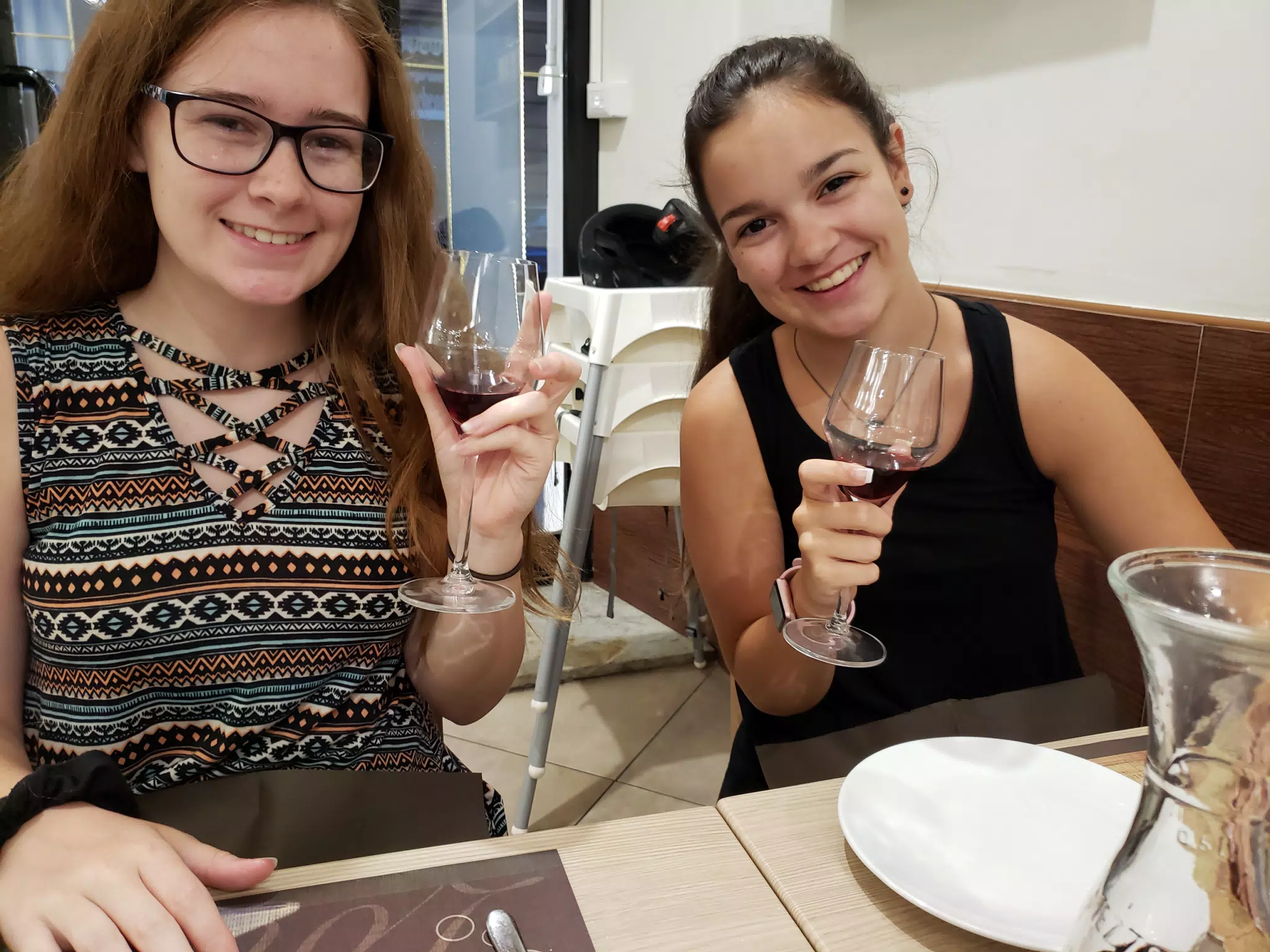 Madeline and Emily with Wine at Dinner in Rome