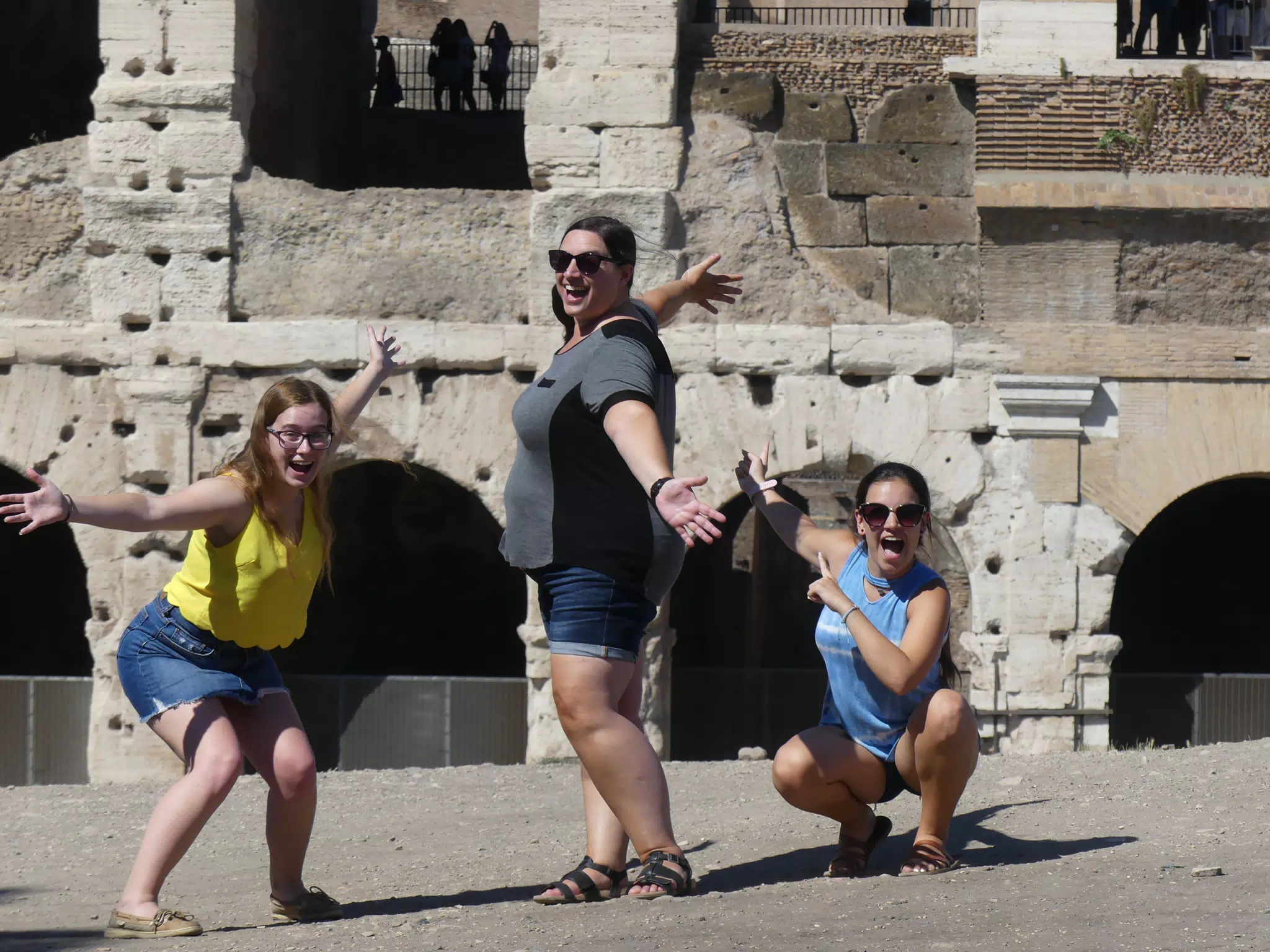 The Girls Showing Off the Colosseum