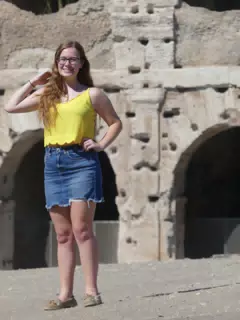 Madeline in Rome in Front of the Colesseum
