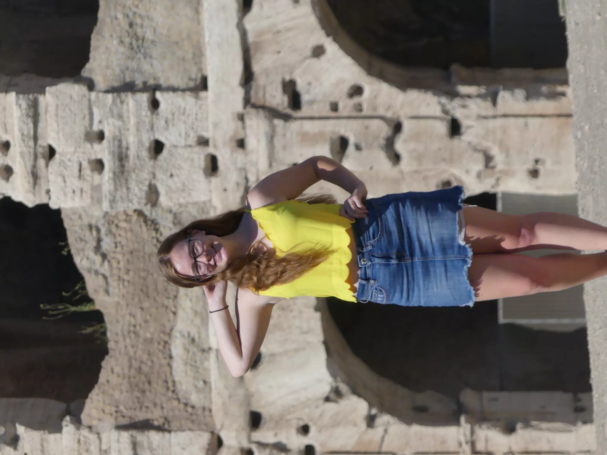 Smiling Teen in Yellow at Colosseum
