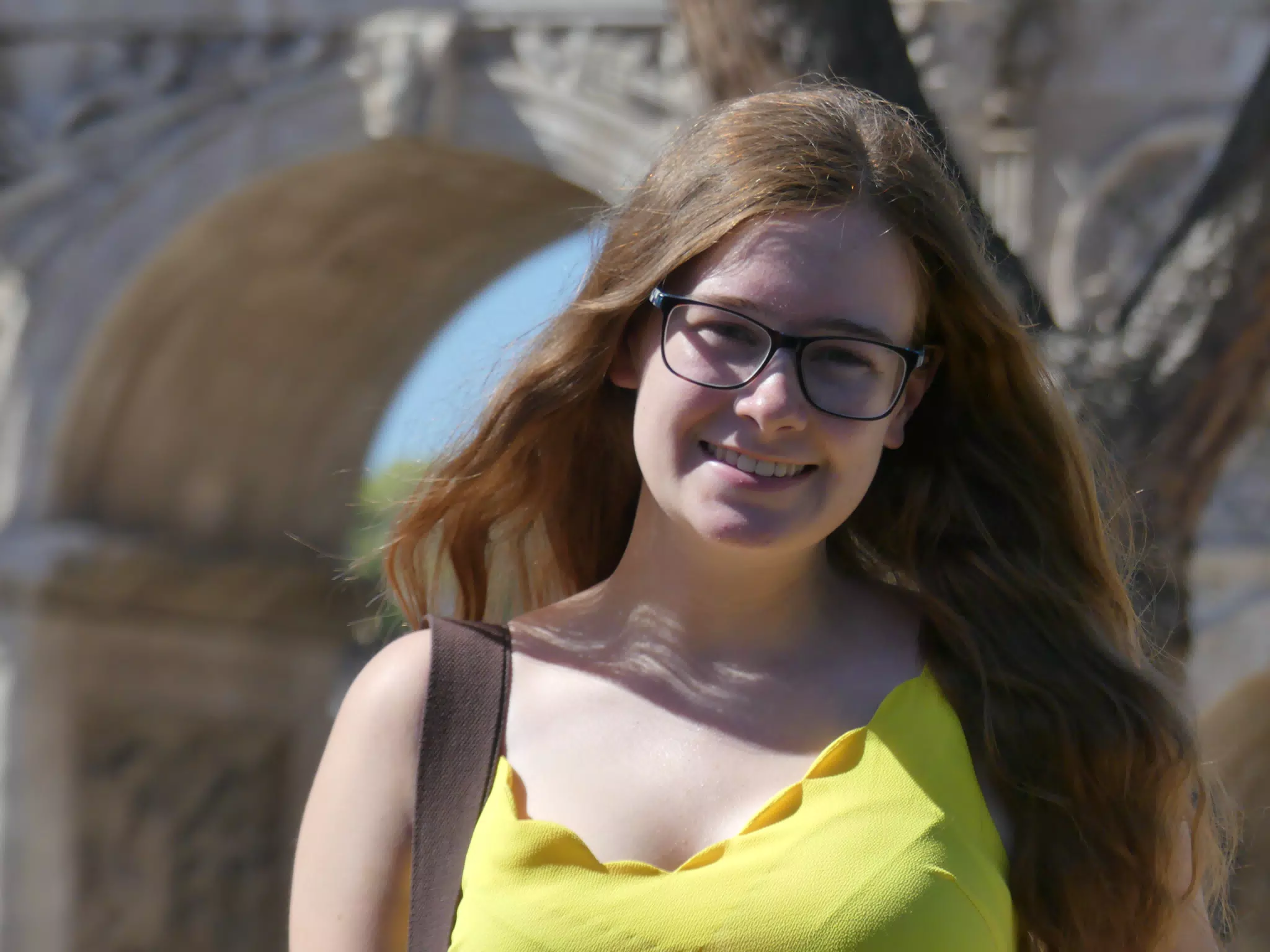Teen Brunette in Glasses at Arch in Rome