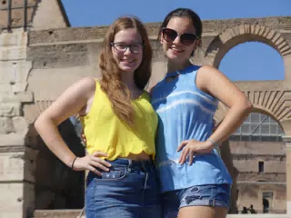 Teen Sisters Posing at the Colosseum in Rome