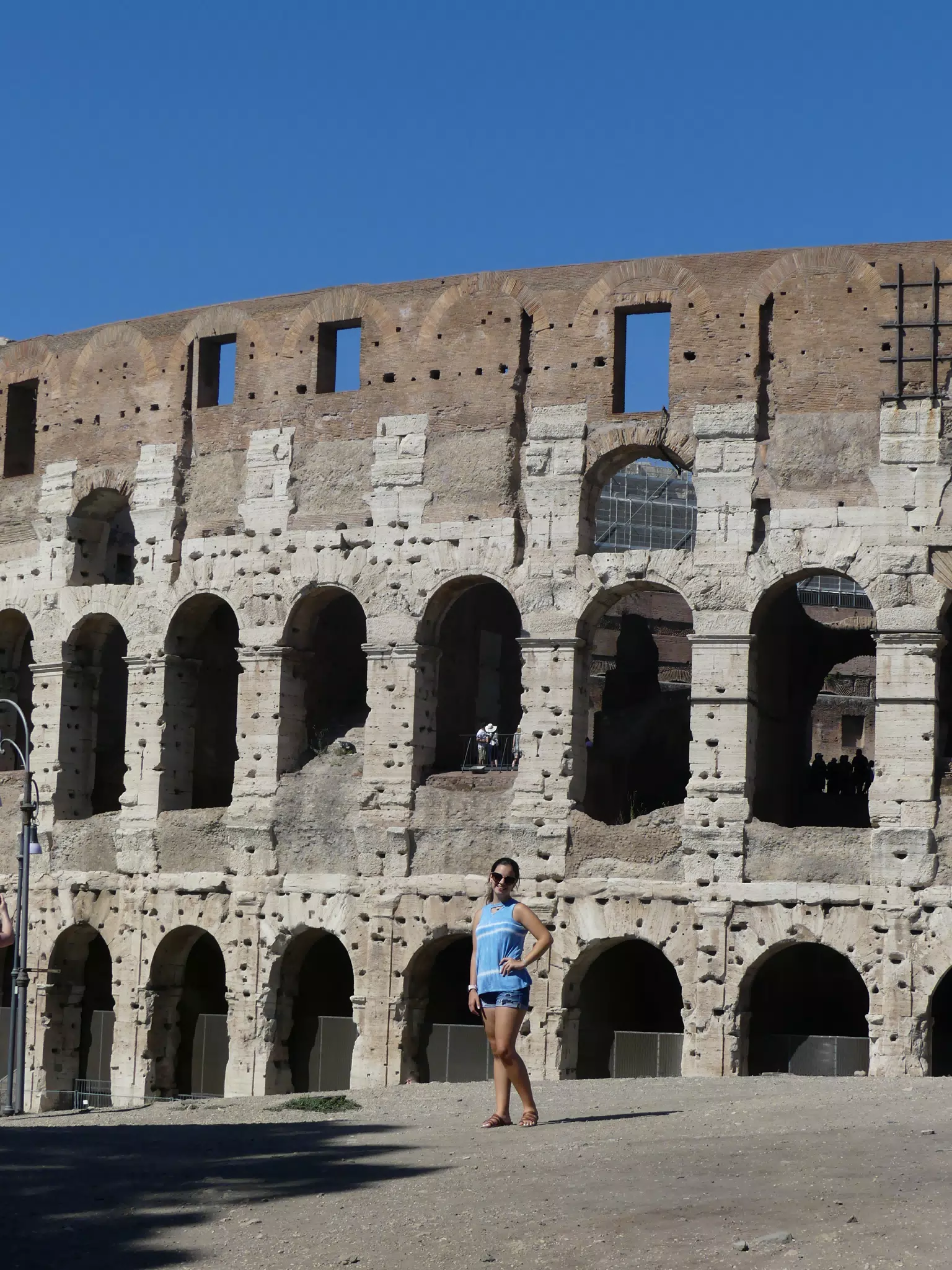 Teen in Front of Colosseum