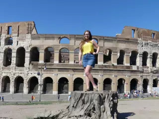 Madeline on Tree Stump at the Colosseum