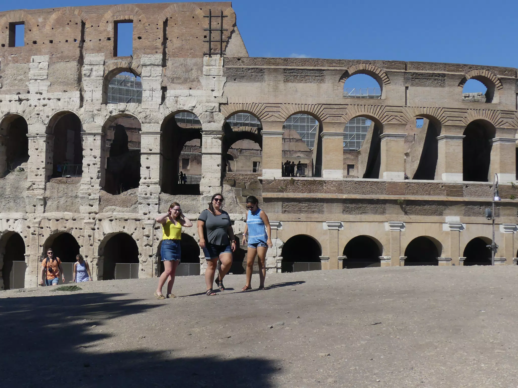Girls Walking by the Colosseum