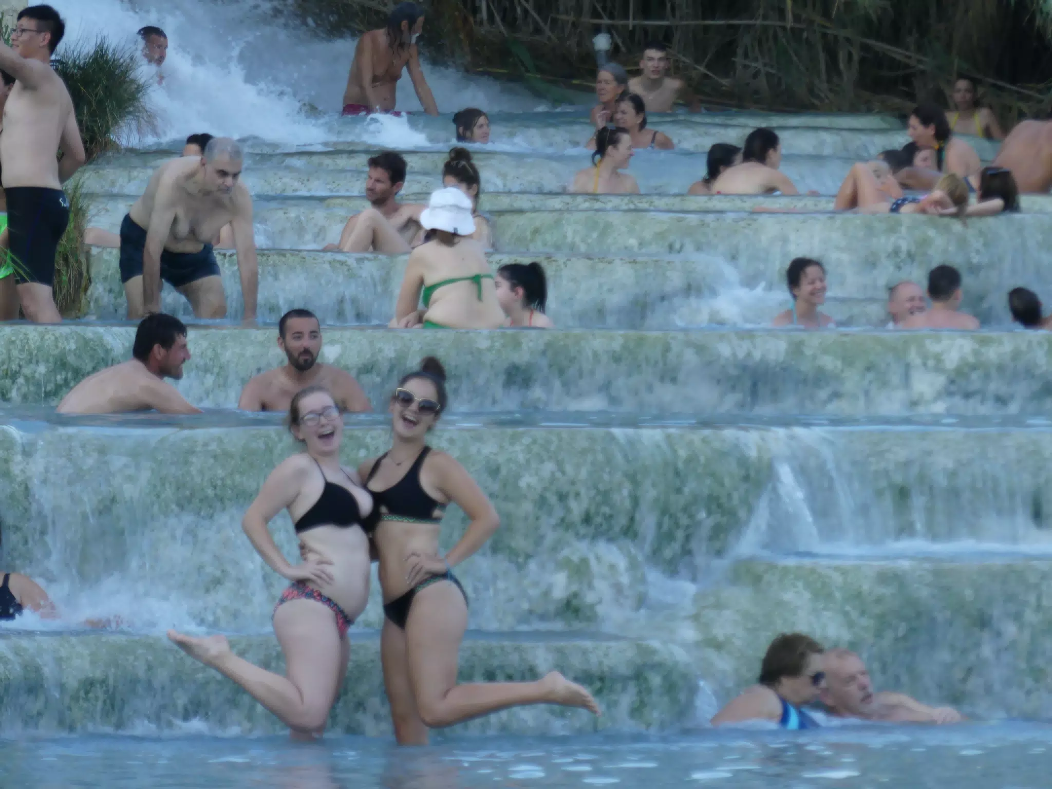 Sisters Posing at Saturnia Waterfall with Hordes of Bathers