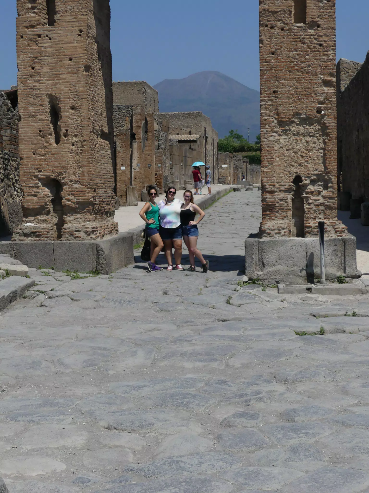 The Girls Posing Under Arch in Pompeii