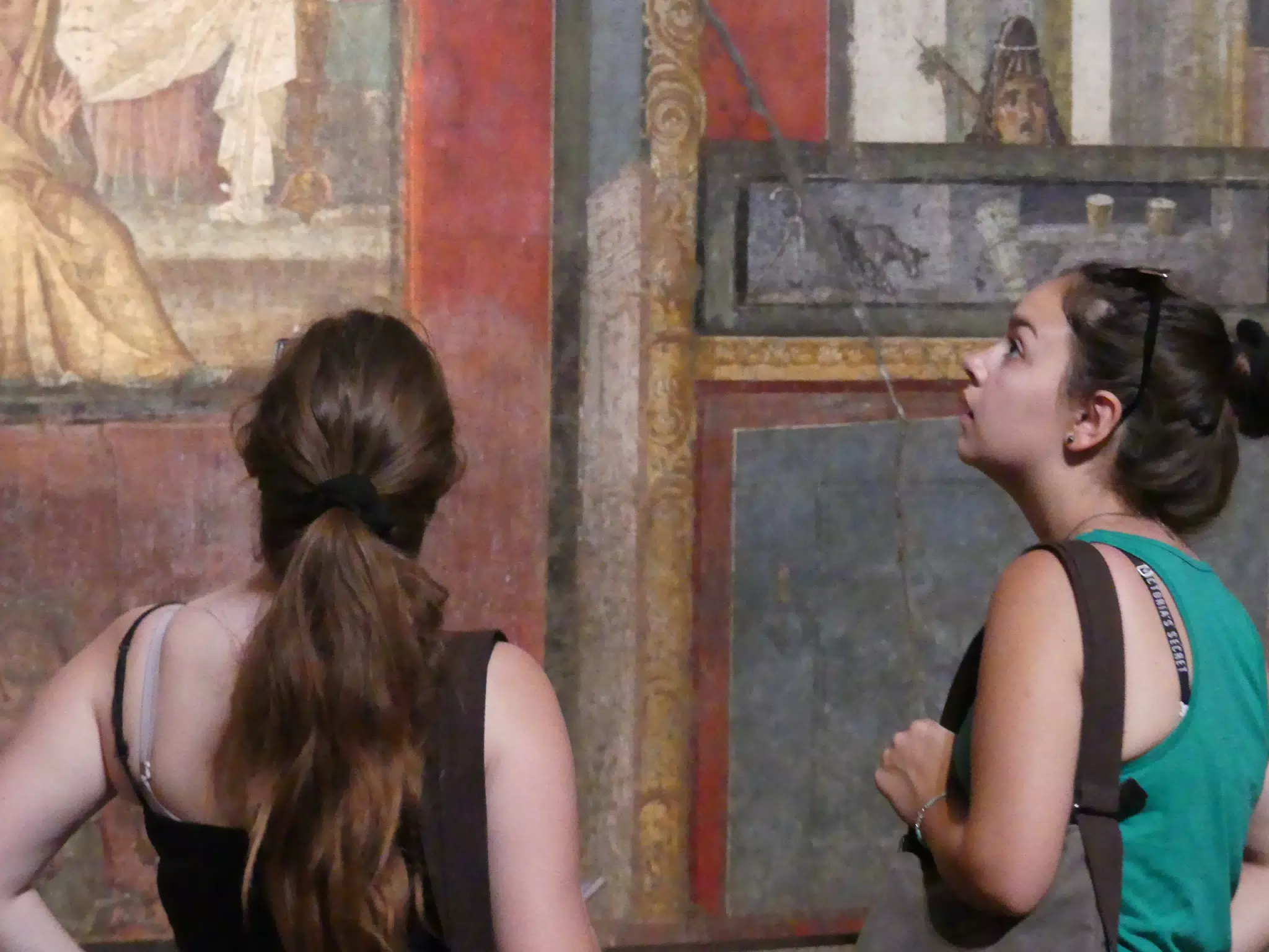 Madeline & Emily Looking at Frescos in Pompeii