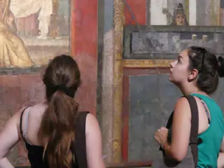 Madeline & Emily Looking at Frescos in Pompeii