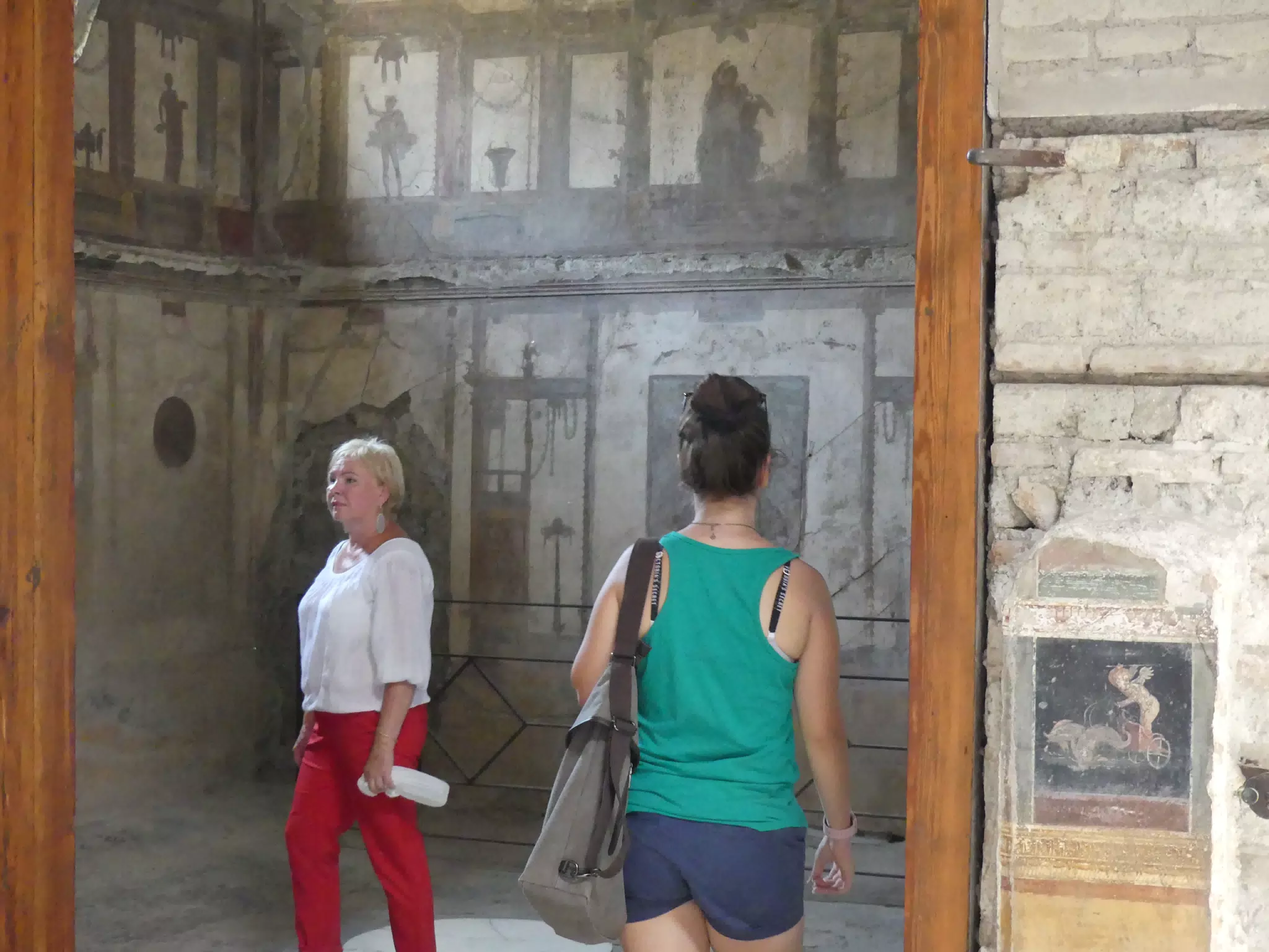 Emily Entering Fresco Room in Pompeii