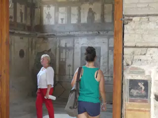 Emily Entering Fresco Room in Pompeii