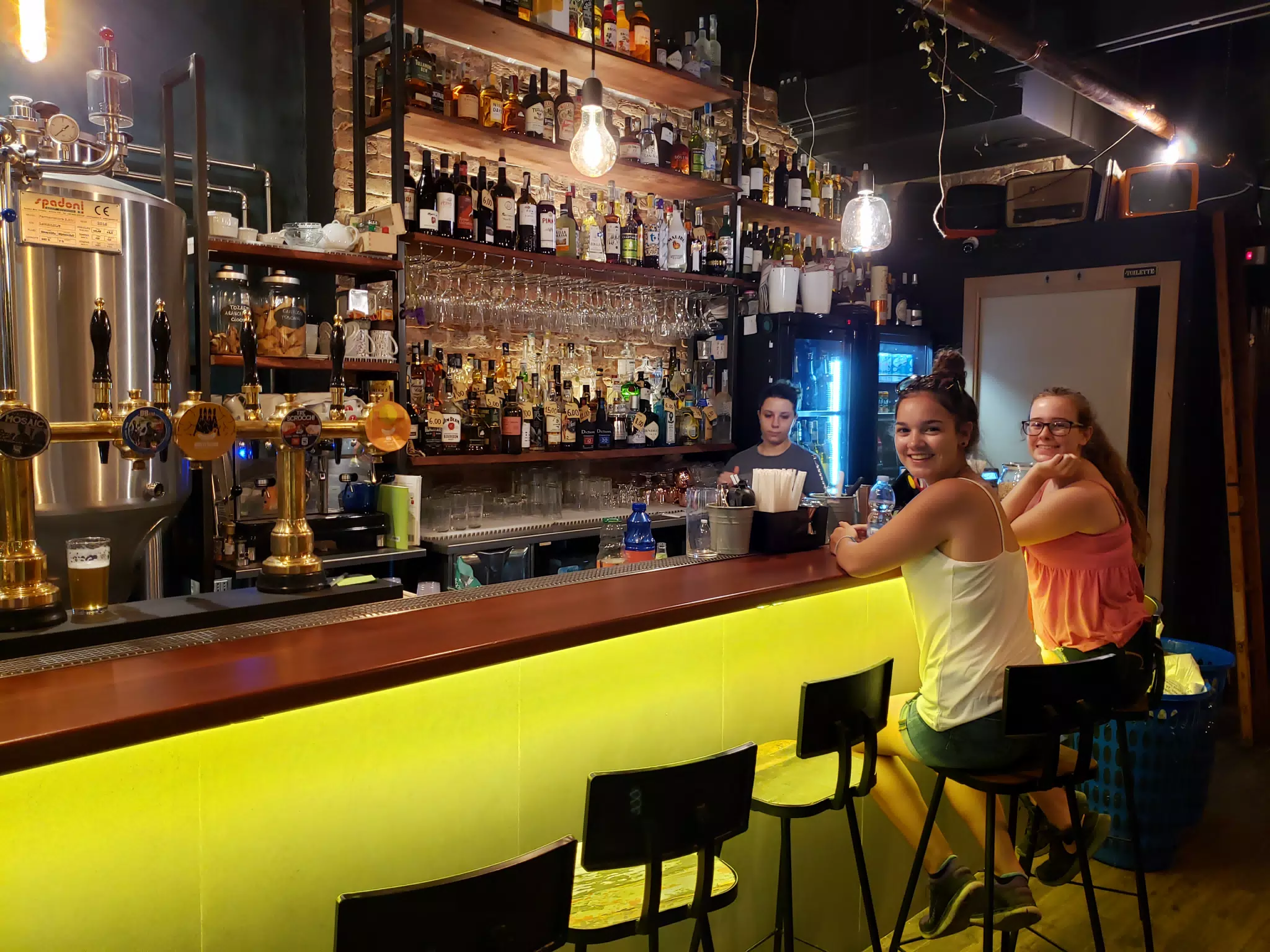 Emily & Madeline Sitting at the Bar in Orvieto