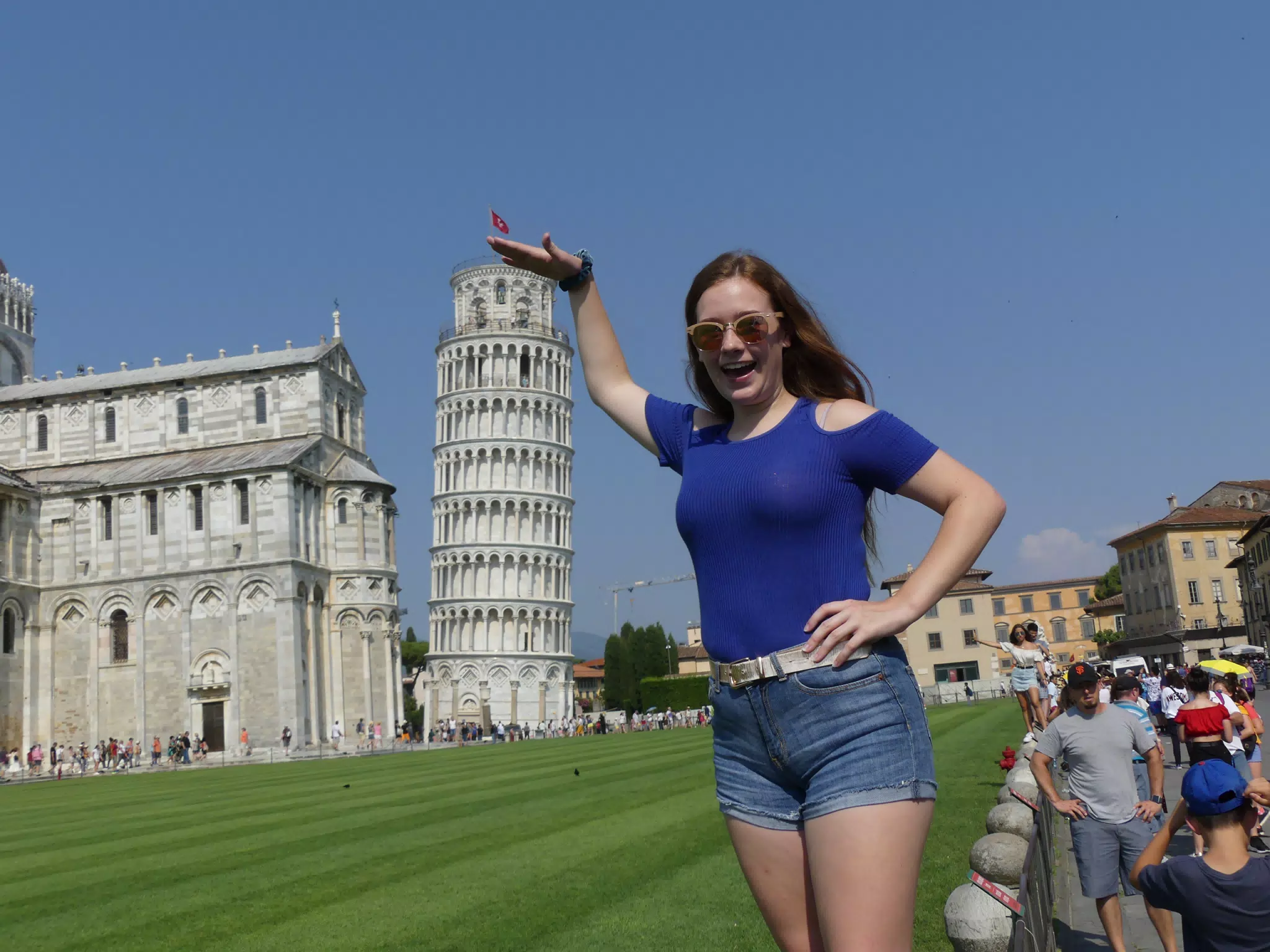 Madeline Demonstrating the Height of the Leaning Tower of Pisa
