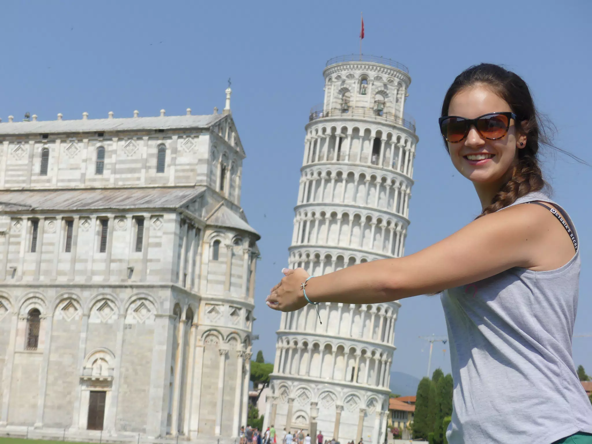 Girl Attempting to Hug the Leaning Tower of Pisa