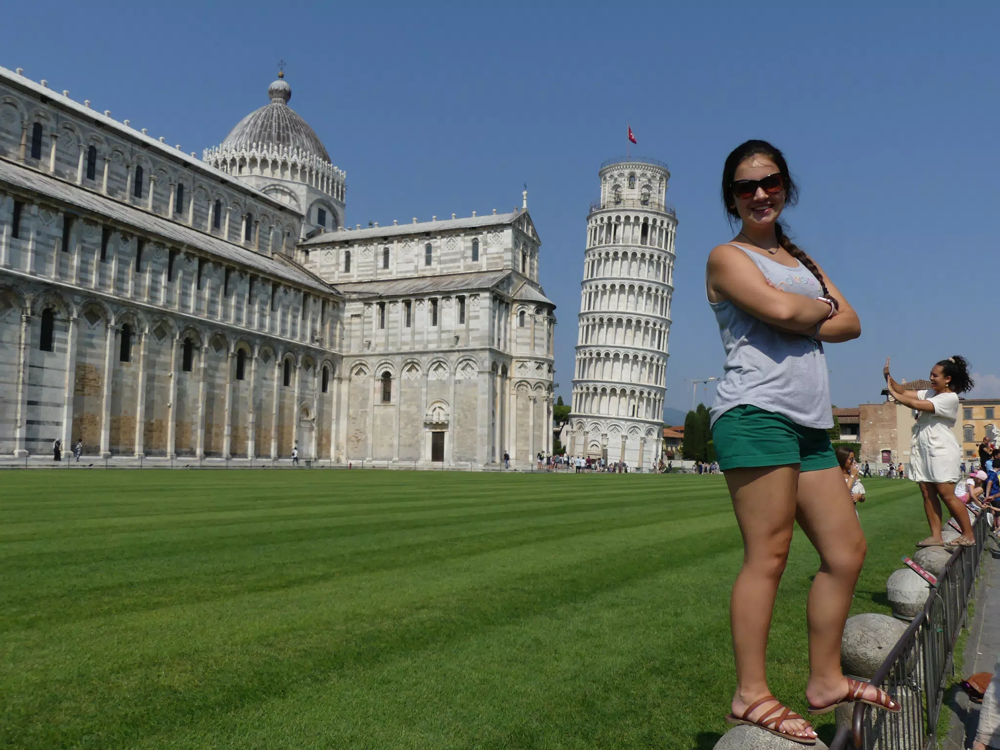 Emily Standing on Fence by Leaning Tower of Pisa