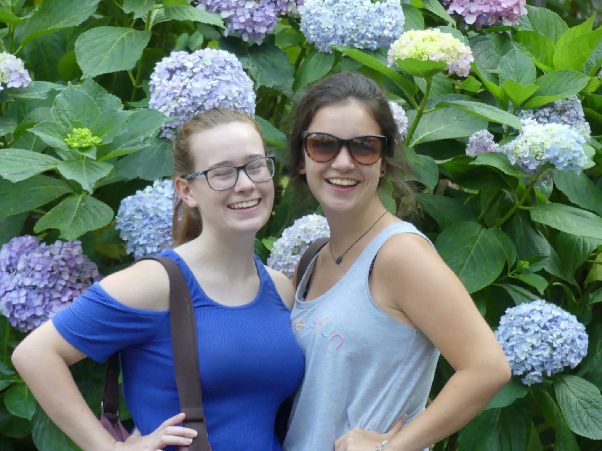 Sisters Laughing by Flowers