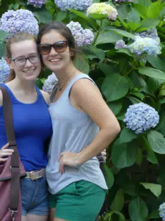Madeline and Emily with Big Flowers