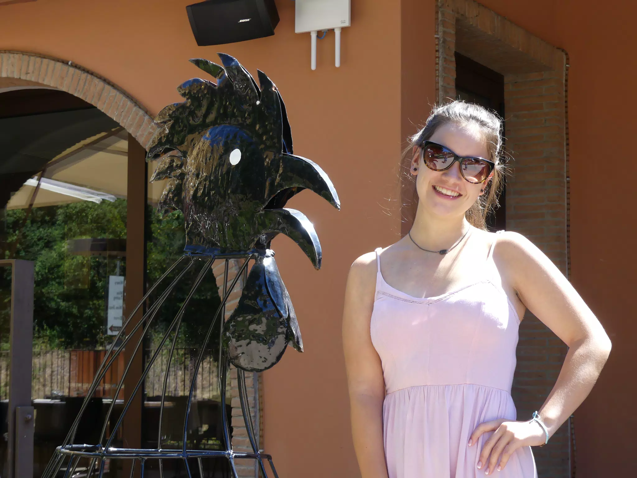 Emily by Bird Statue