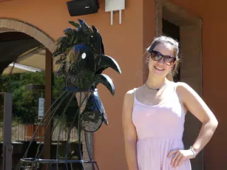 Emily by Bird Statue