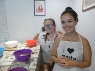 Madeline and Emily Making Pasta in Italy