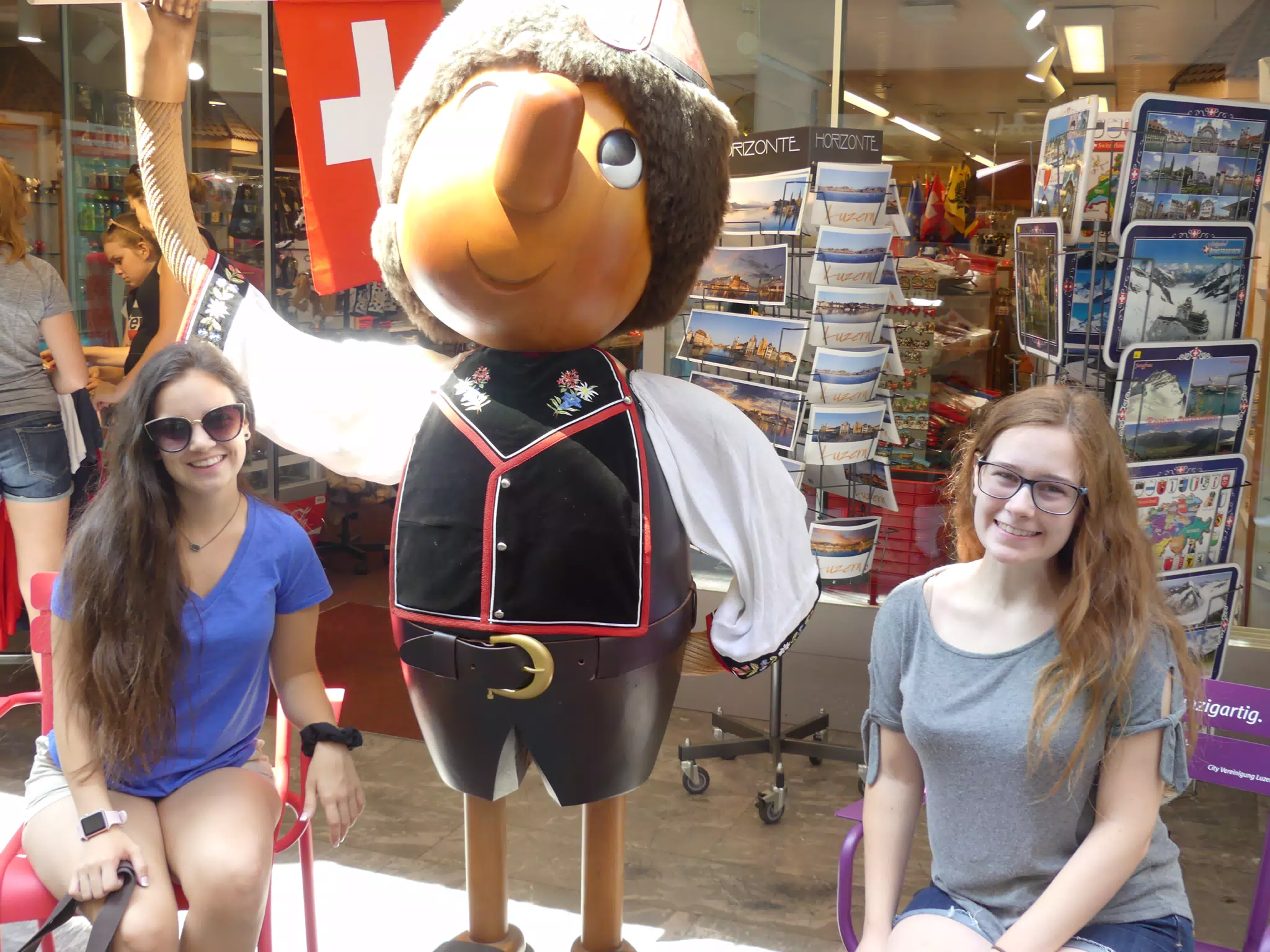 Emily and Madeline with Tourist Statue in Luzern